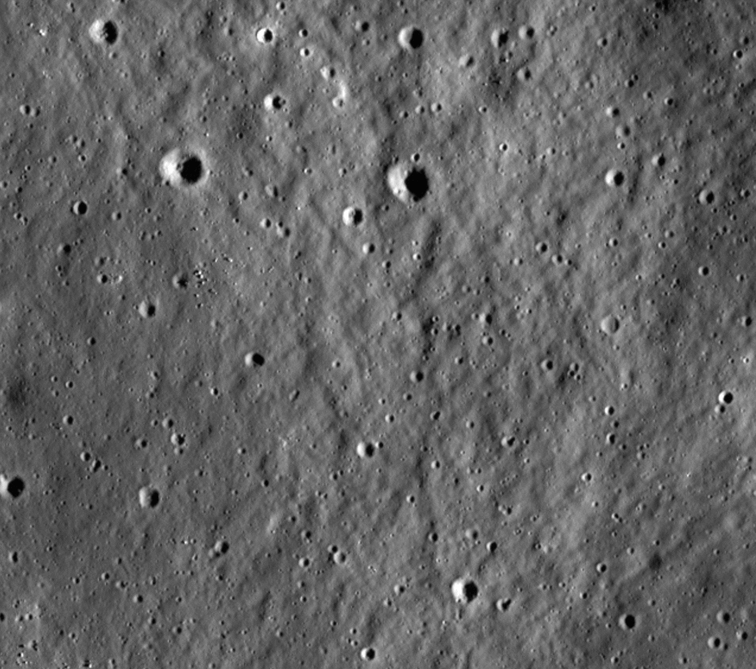 A portion of the Moon's surface very similar to the first image in the article. A bright crater with distinctive ejecta rays blinks in and out of existence in the center of the frame. The images before and after the appearance of the crater are very closely aligned so that, for the most part, the features are the same. There are slight changes in the lighting angle between the before and after images.