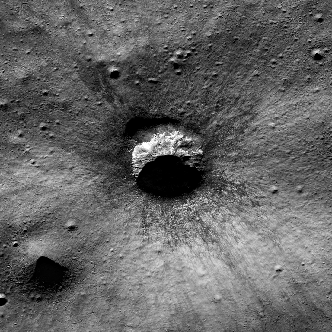 Spectacular late stage impact melt decorates the crater rim!